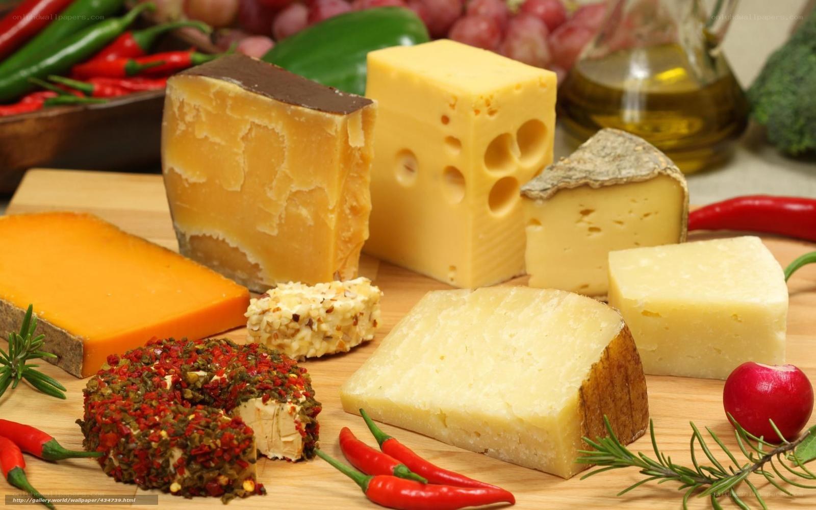 assorted cheeses with herbs and peppers