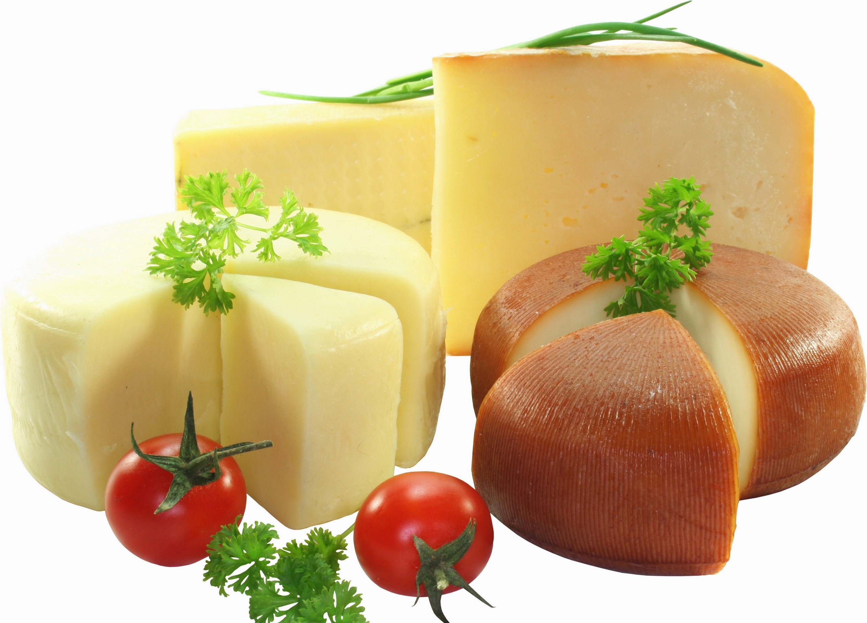 assorted cheeses with herbs and tomatoes