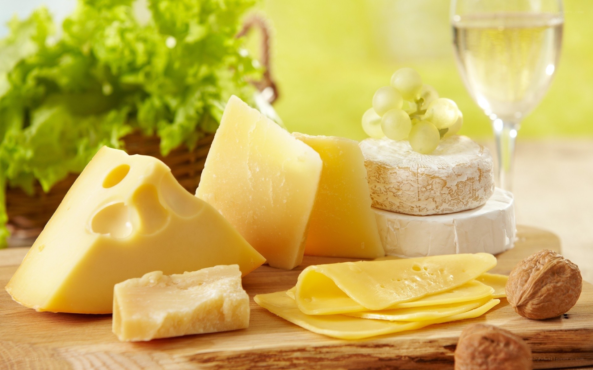 Assorted cheeses with wine and grapes