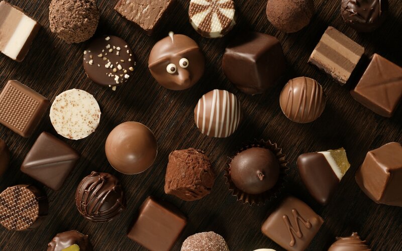 Assorted Chocolate Candies — Brown, Appetizing, Photograph, Wooden Surface