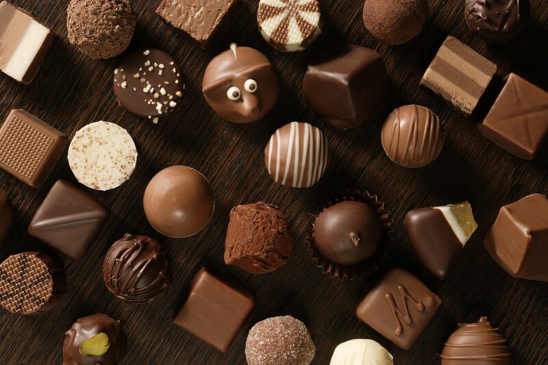 Assorted chocolates on wood