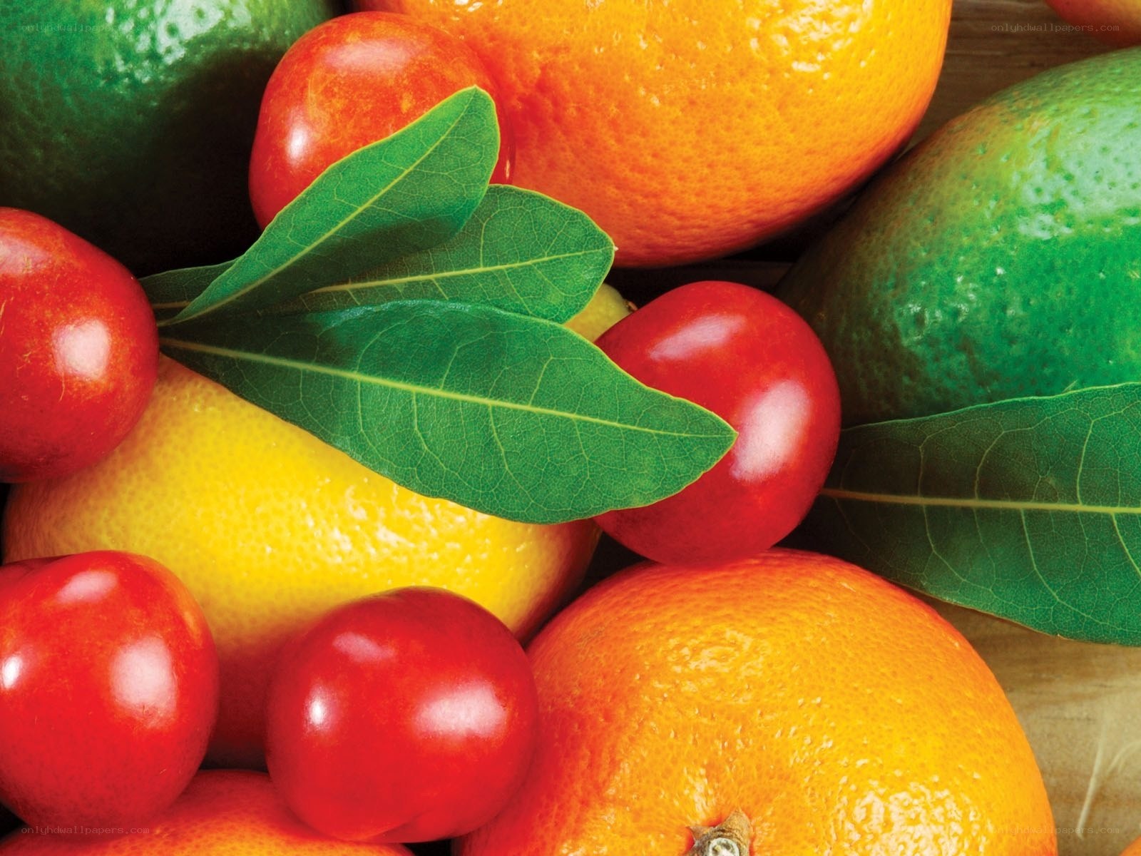 Assorted citrus fruits with leaves
