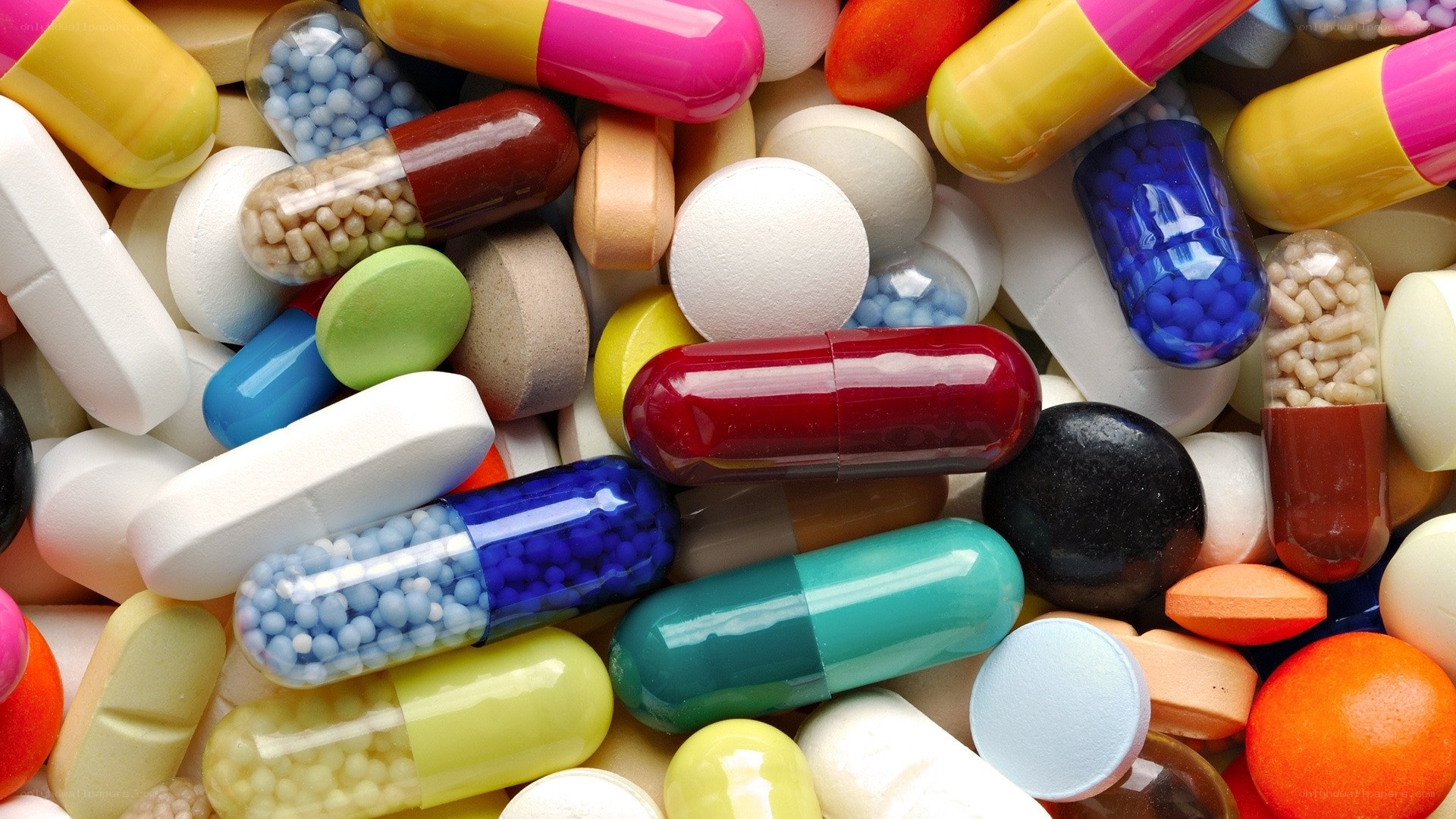 assorted colorful pills and capsules