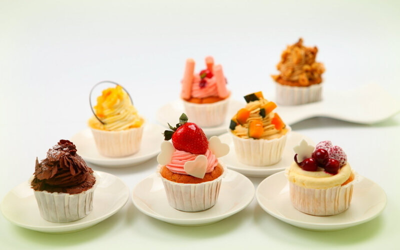 Assorted Cupcakes on Plates