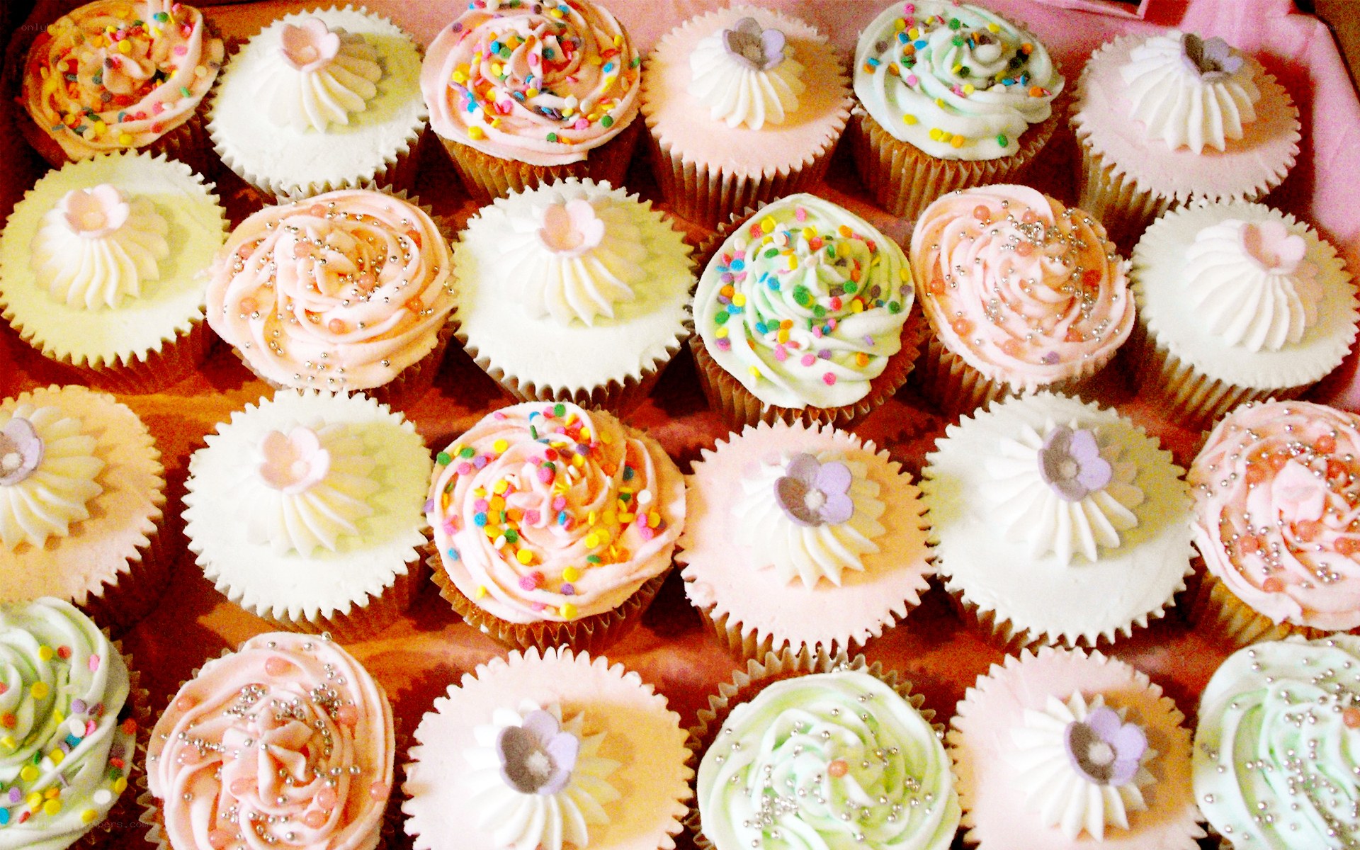 Assorted cupcakes with sprinkles