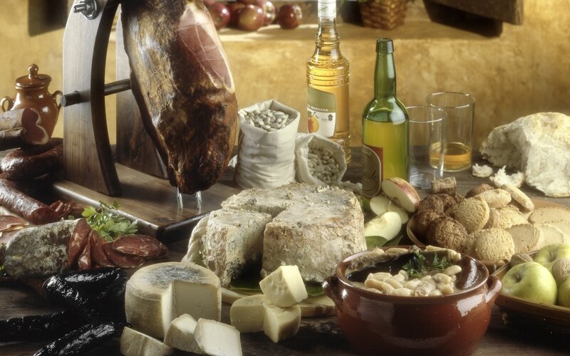 Assorted cured meats and cheeses