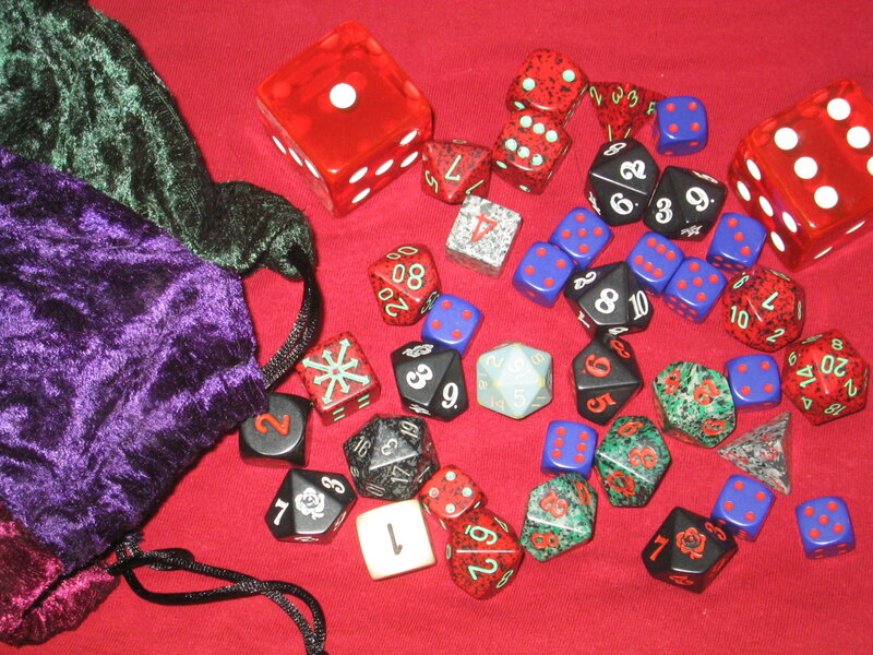 assorted dice on red cloth