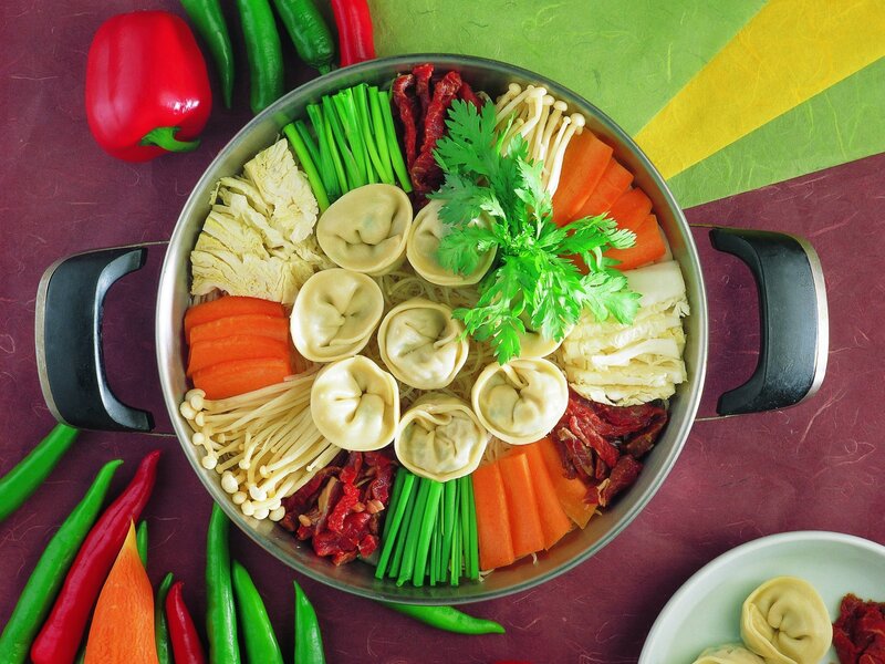 Assorted dumplings in a pot