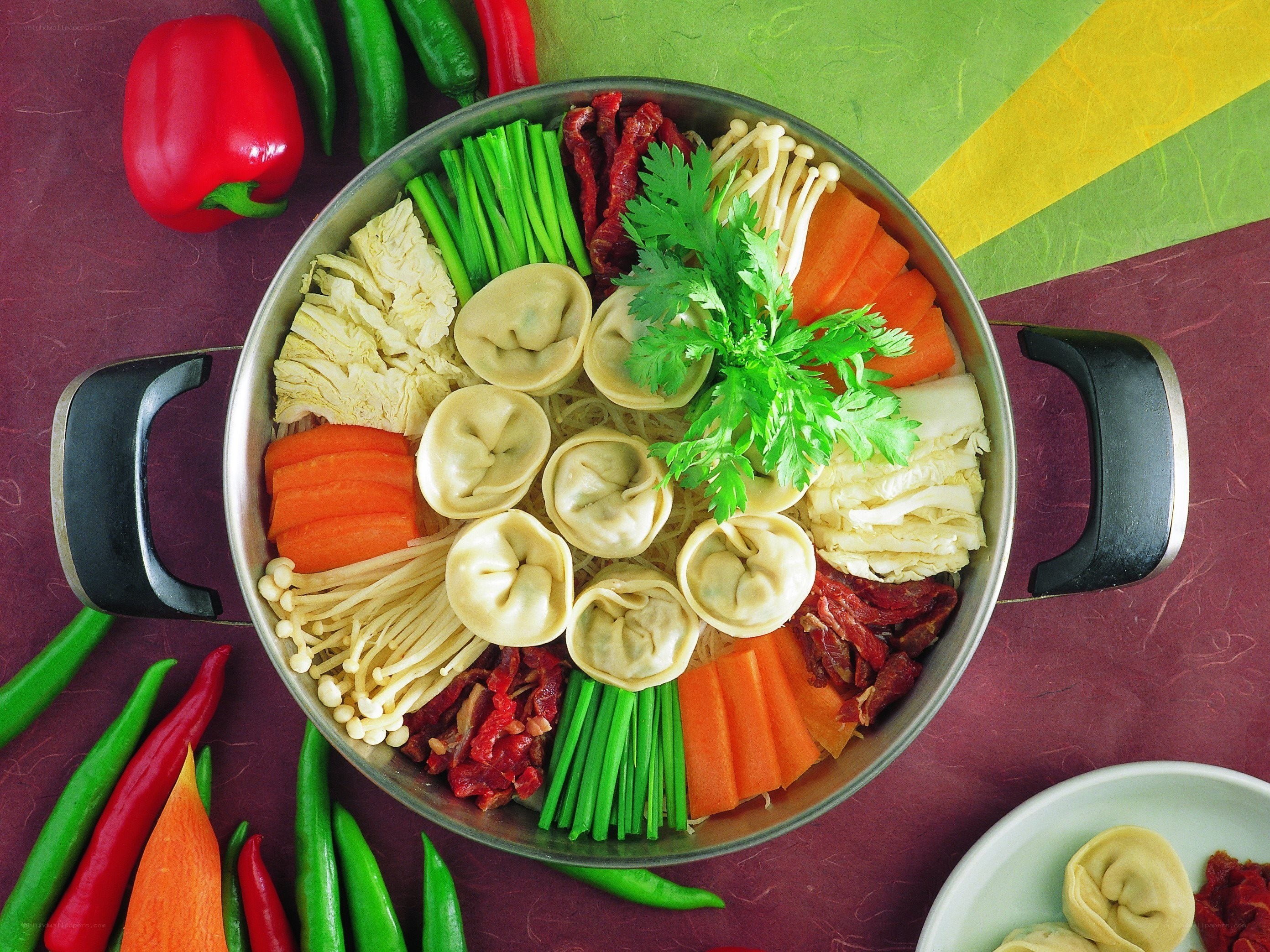 Assorted dumplings in a pot