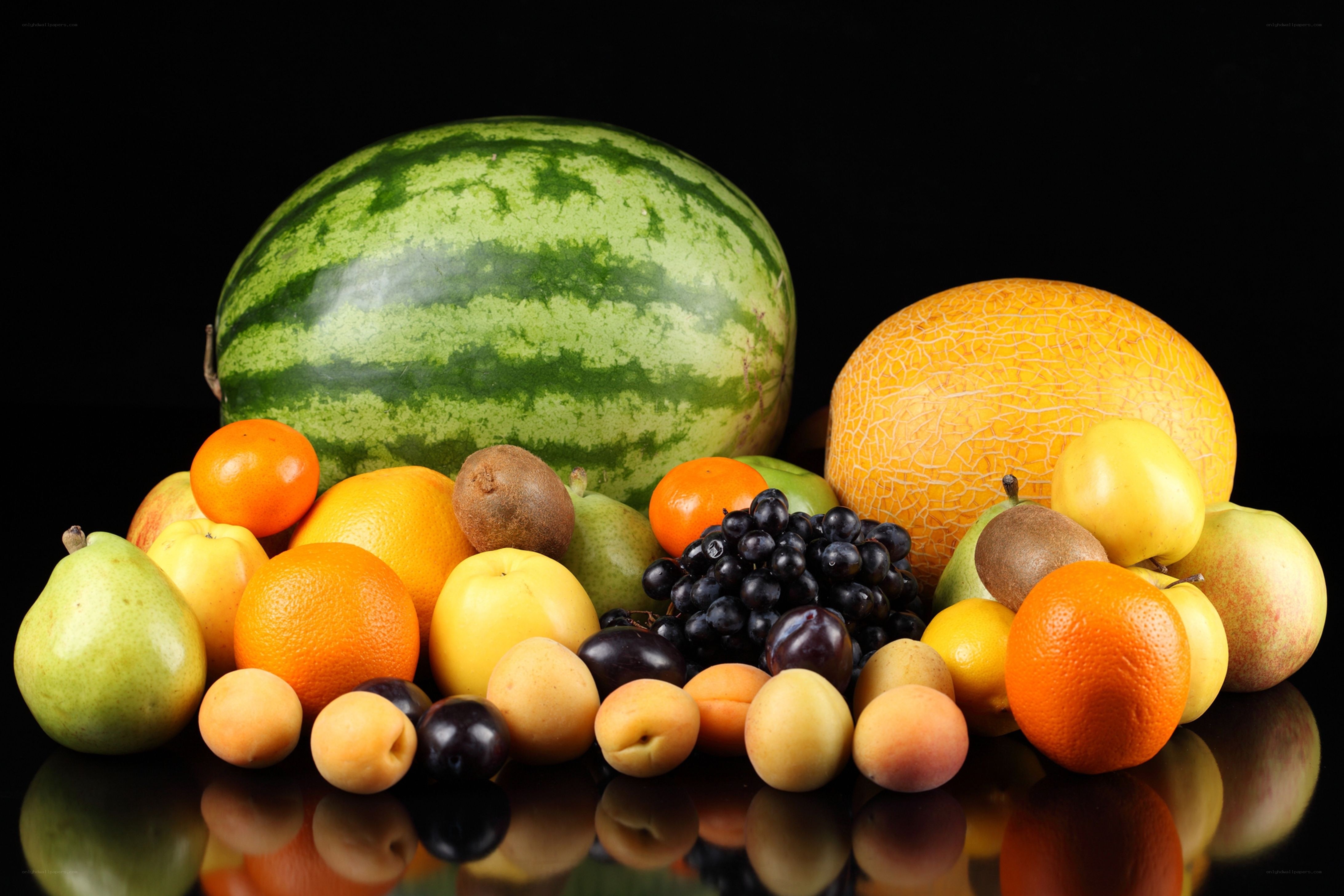 Assorted fresh fruits on black