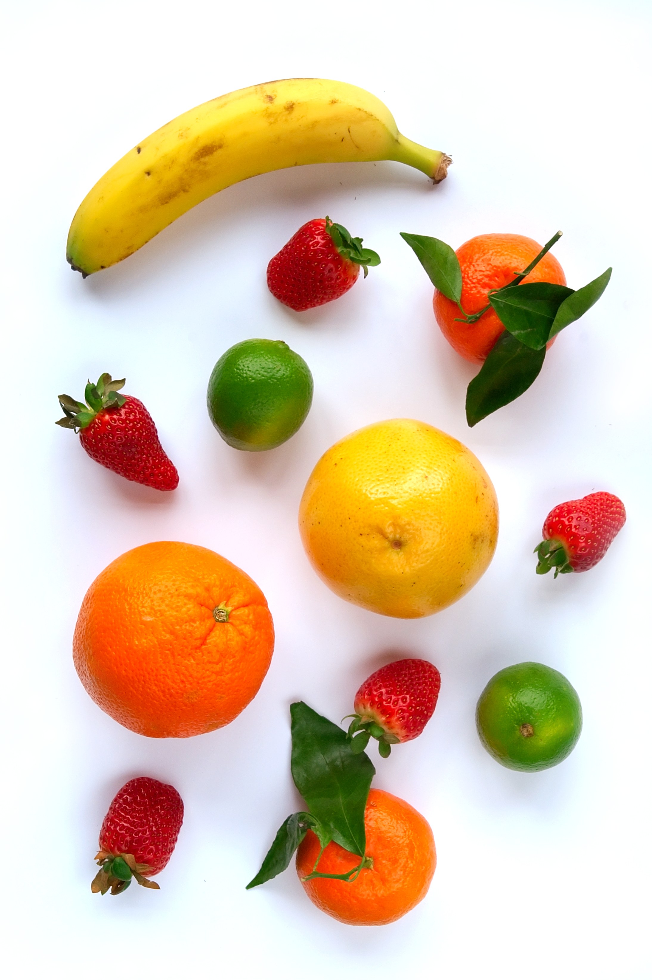 Assorted fresh fruits on white