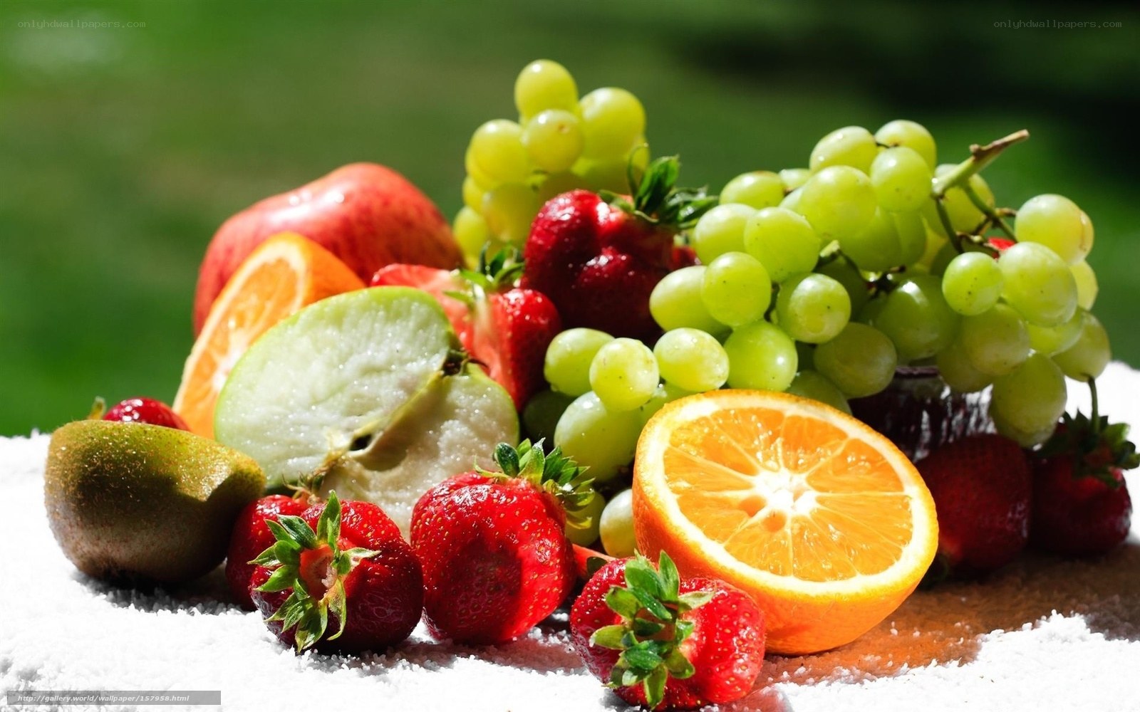 Assorted fresh fruits on white surface