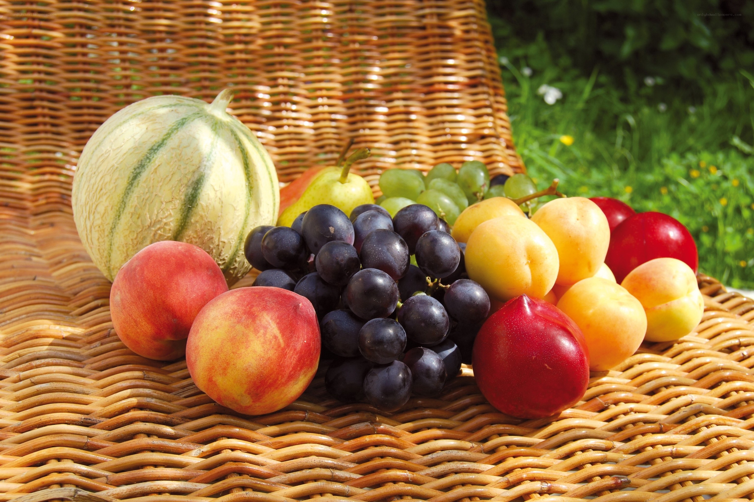 Assorted fresh fruits on wicker basket