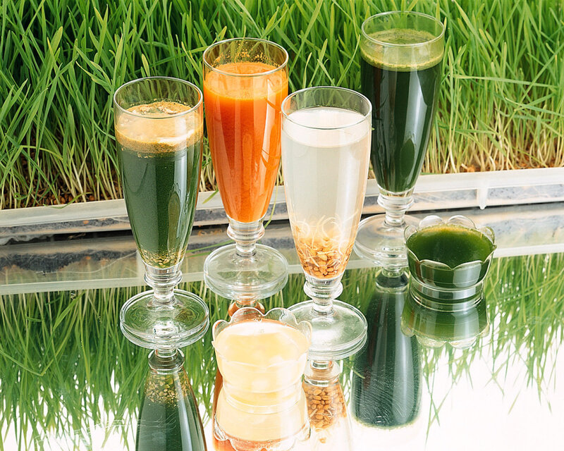 Assorted fresh juices on grass