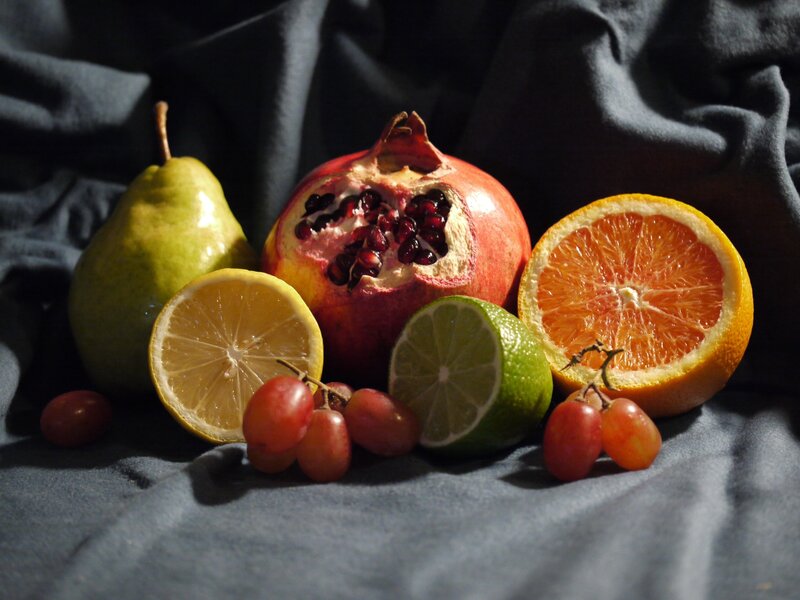 Assorted fruits on dark cloth