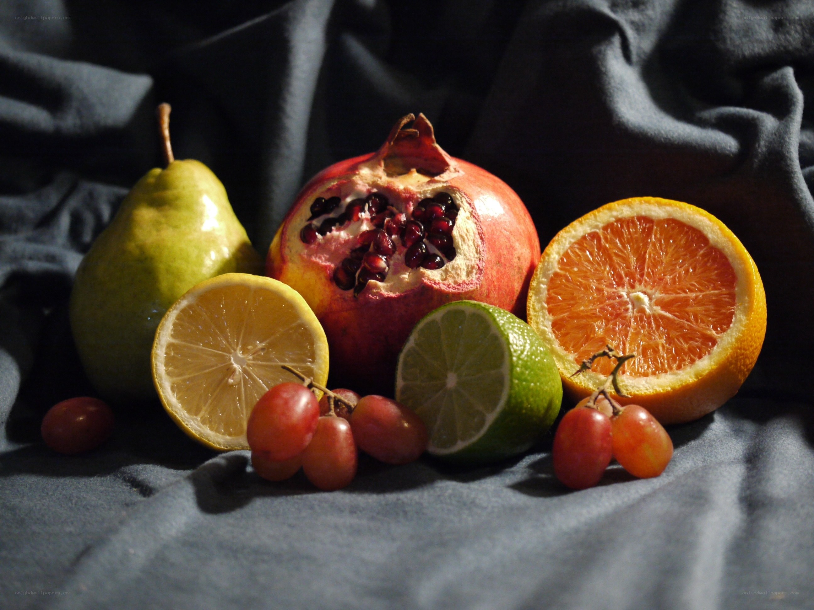 Assorted fruits on dark cloth