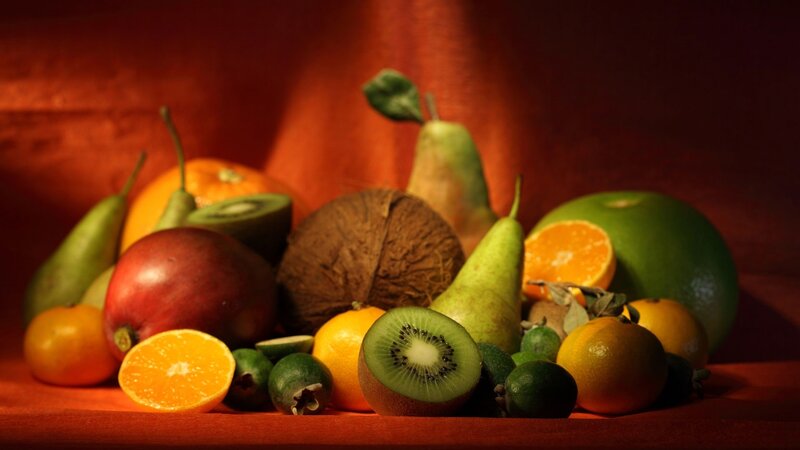 Assorted fruits on red surface