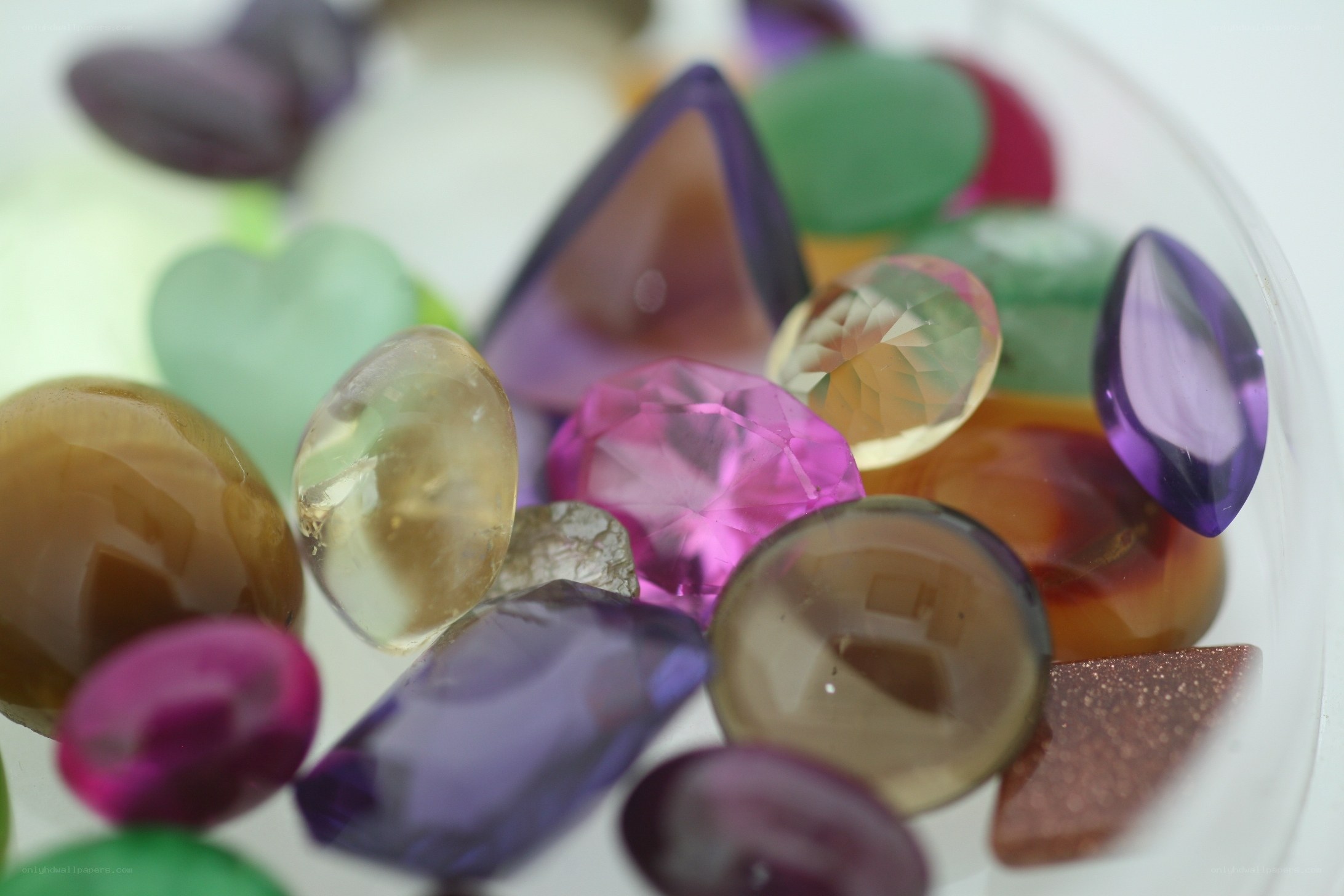 assorted gemstones in a bowl
