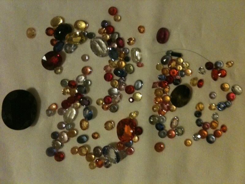 assorted gemstones on fabric