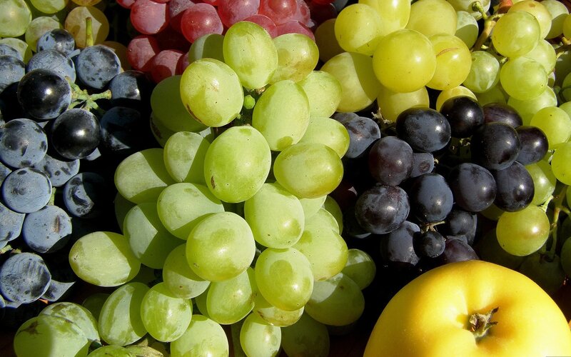 Assorted grapes and apple