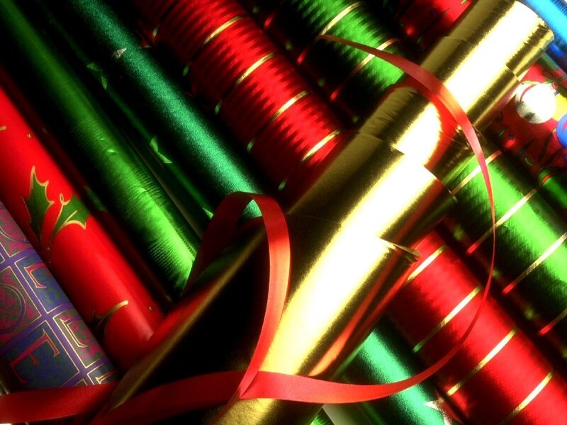assorted holiday wrapping paper rolls