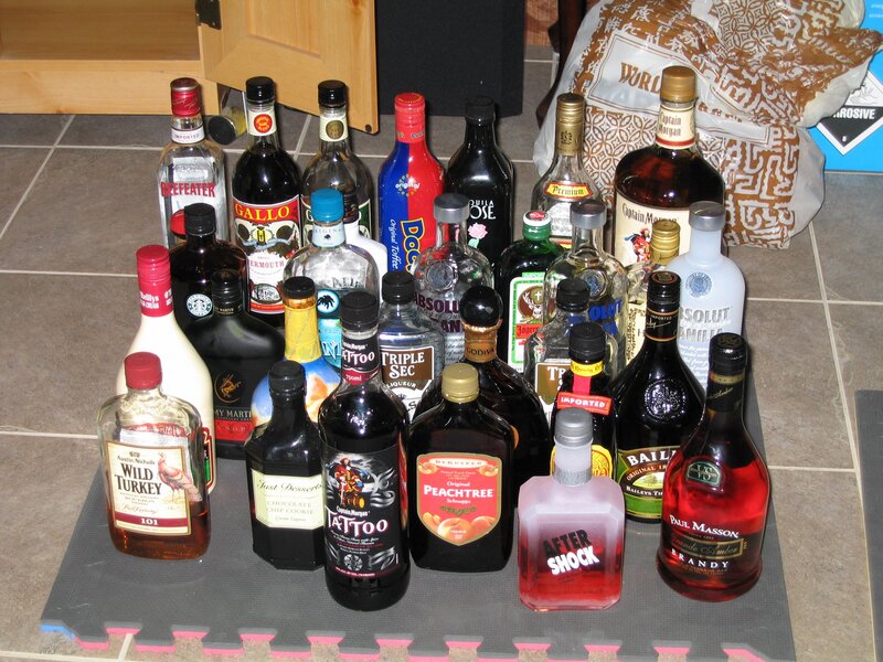 assorted liquor bottles on floor