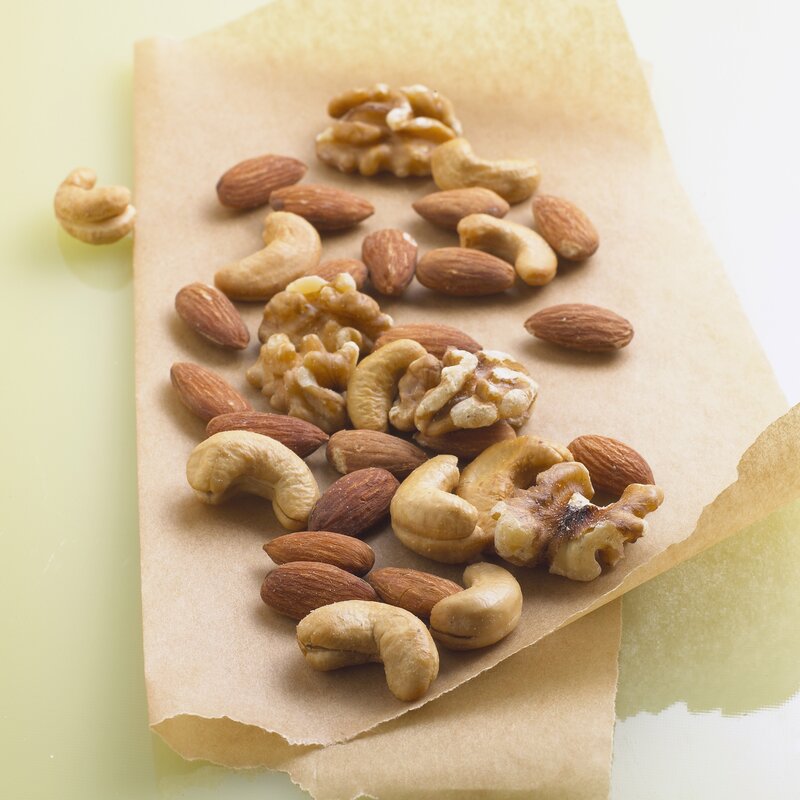 assorted nuts on parchment paper