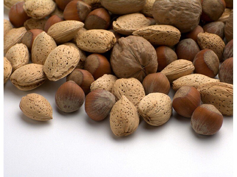 assorted nuts on white surface