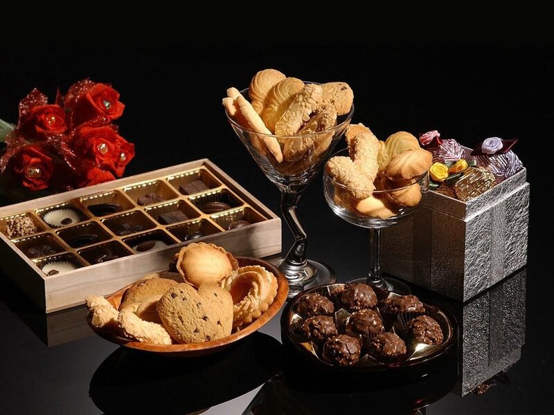 Assorted Pastries and Chocolates — Black, Dramatic, Photograph