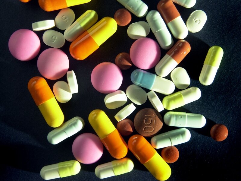 Assorted Pills and Capsules — Black