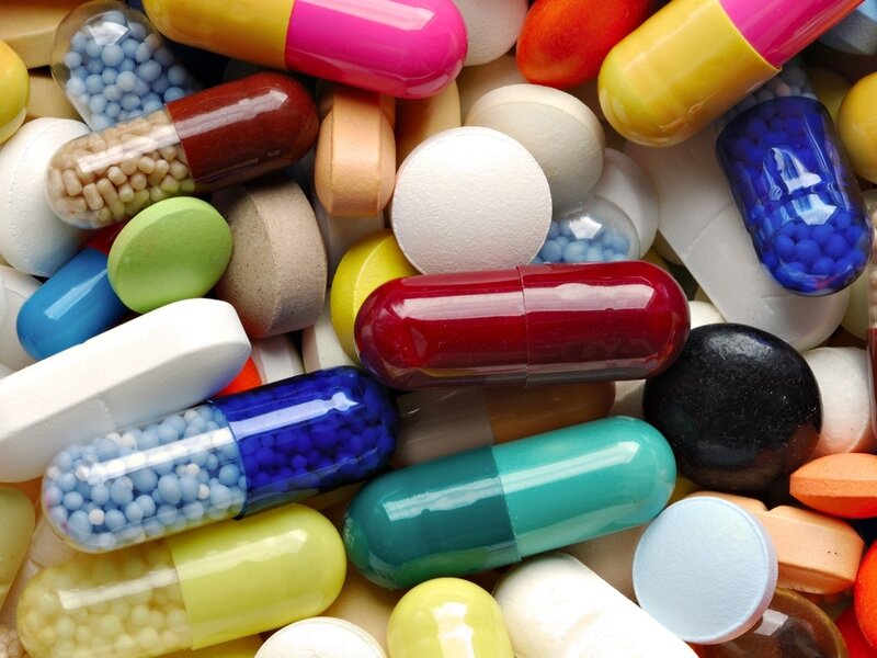 Assorted Pills and Capsules — White