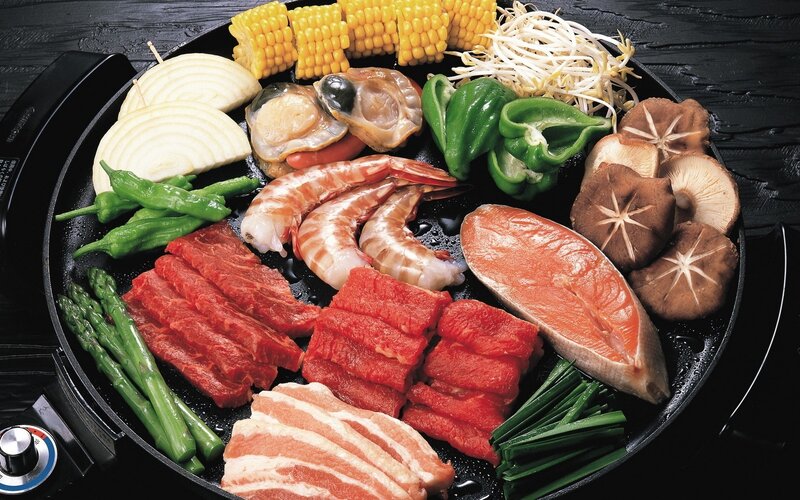Assorted raw meats and vegetables