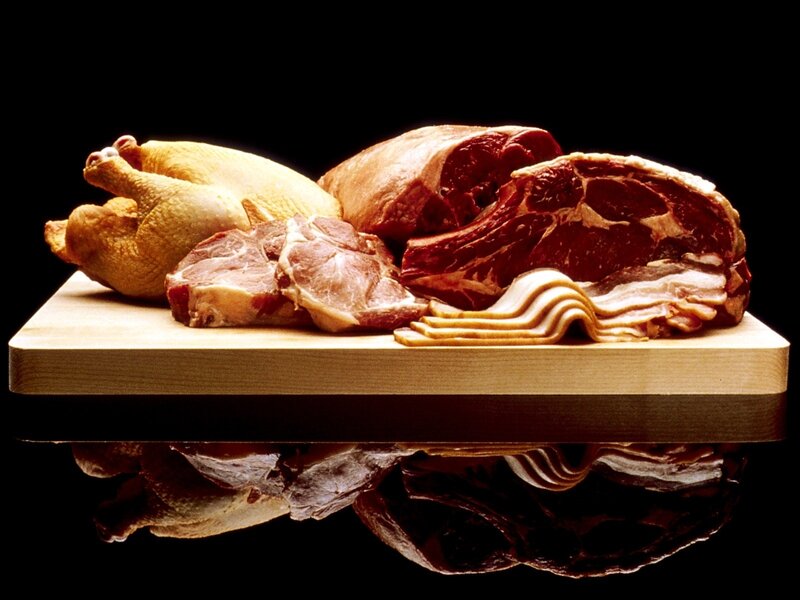 assorted raw meats on cutting board
