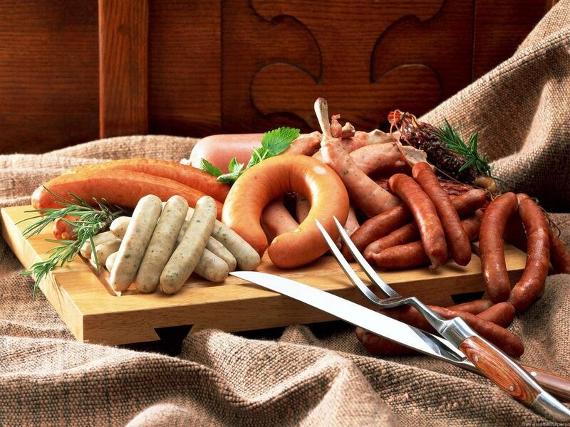 Assorted sausages on a wooden board