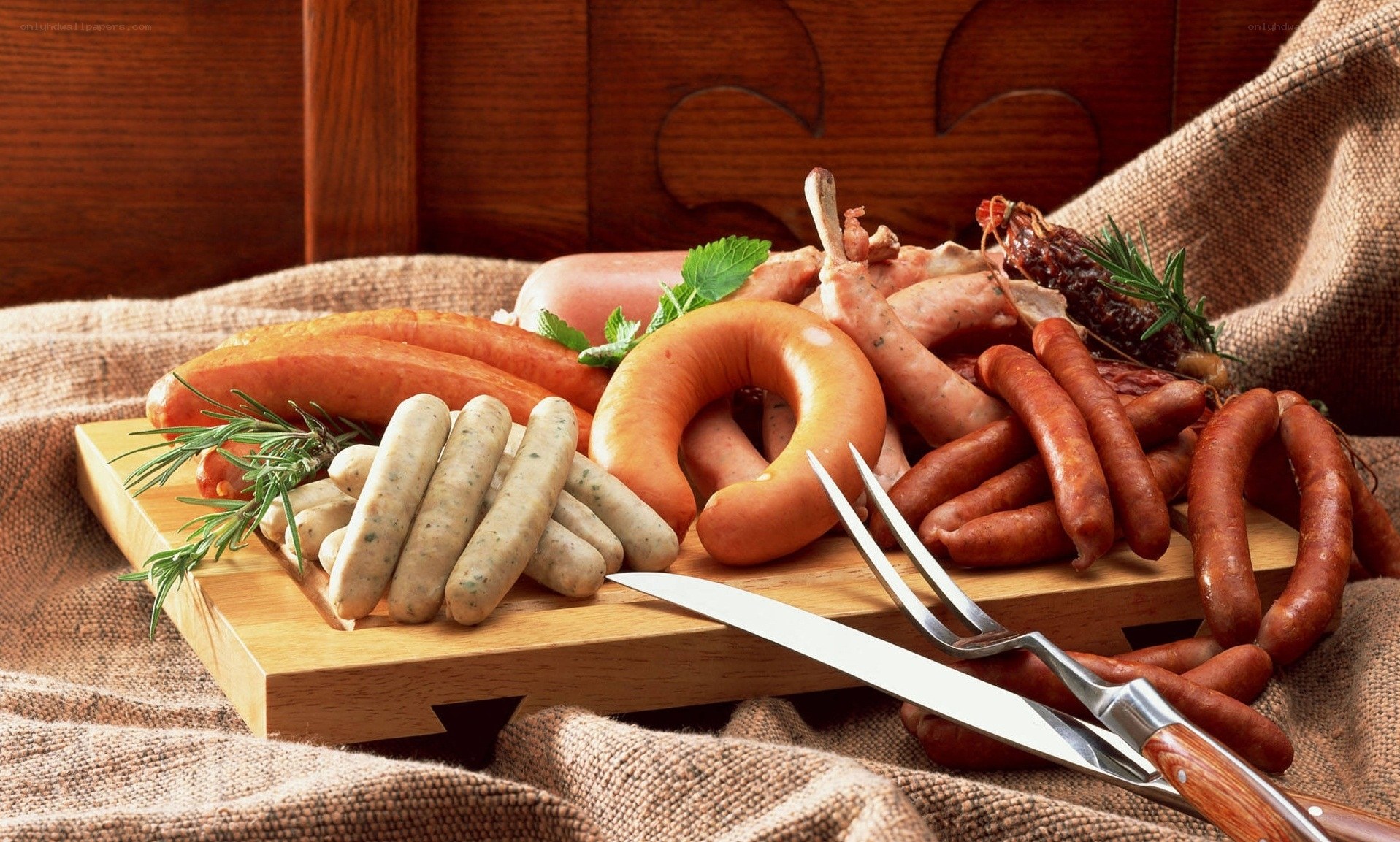 Assorted sausages on a wooden board
