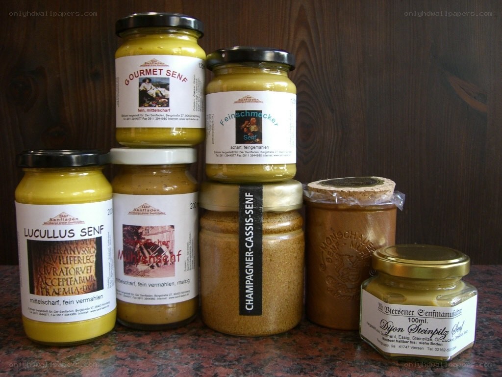 Assorted senf jars on counter