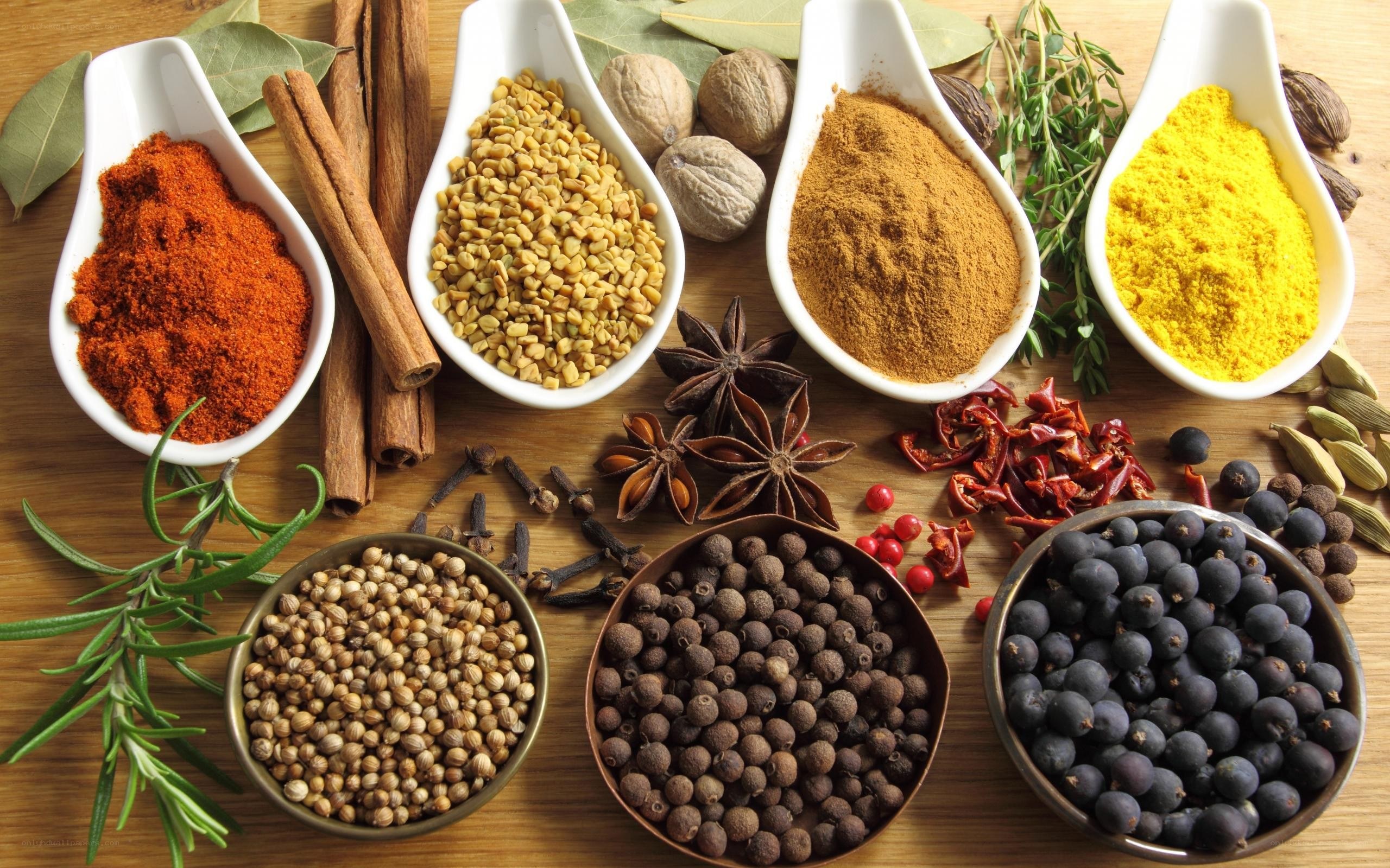 Assorted spices on wooden surface