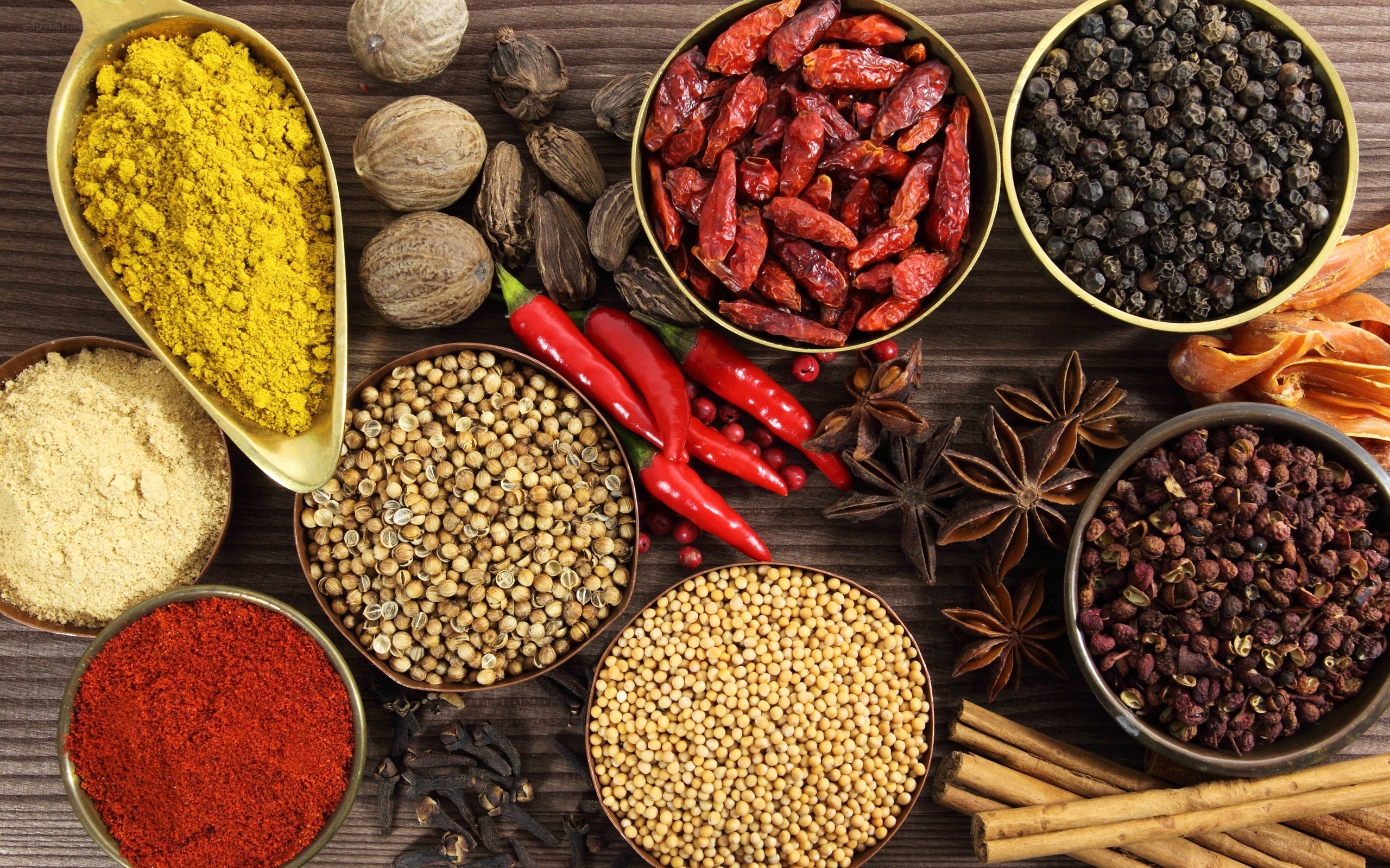 assorted spices on wooden surface