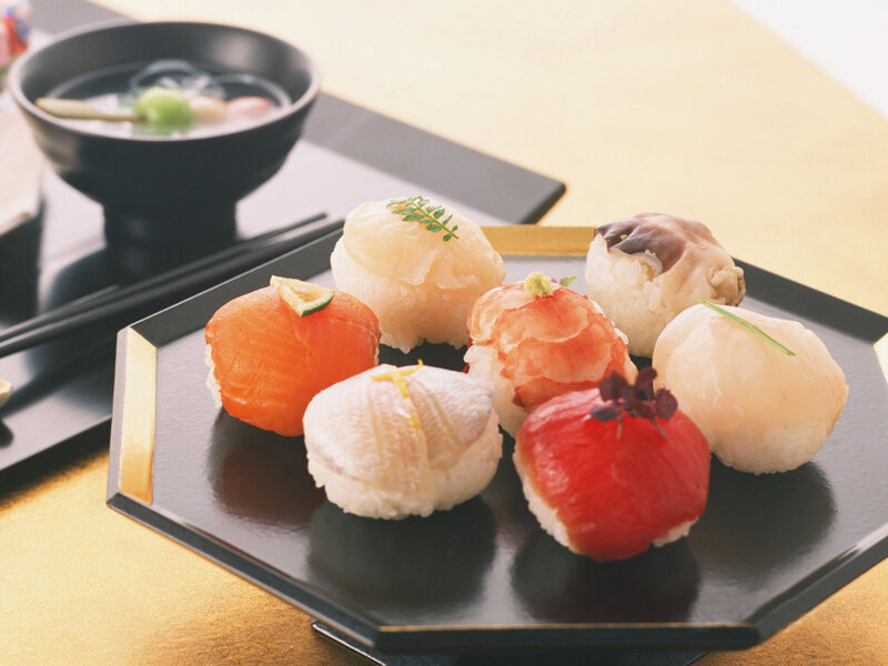 Assorted sushi on a black plate