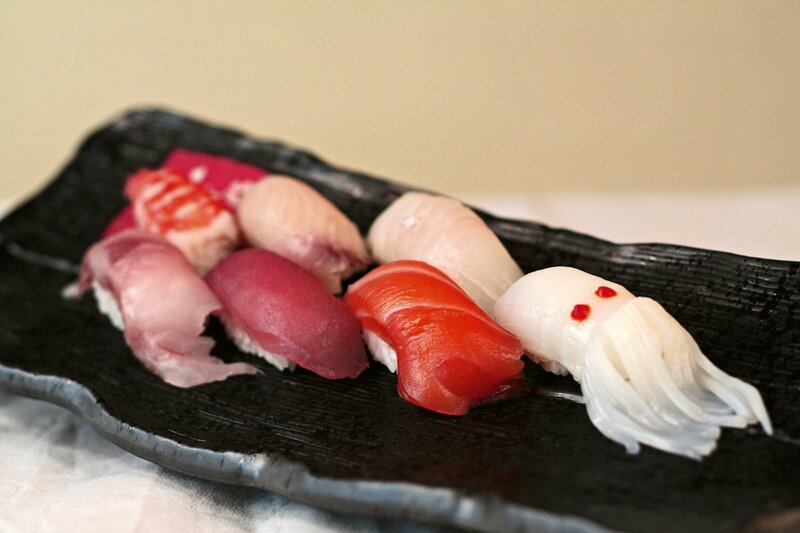 Assorted sushi on black plate