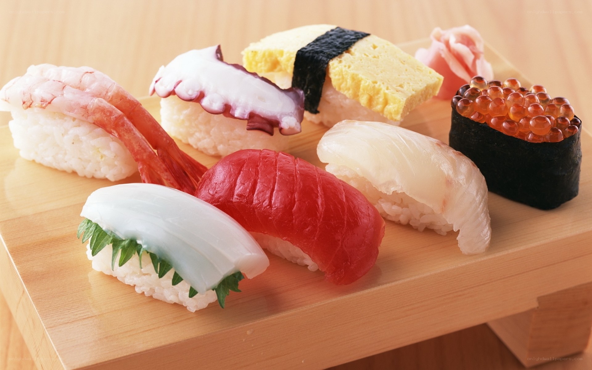 Assorted sushi on wooden board