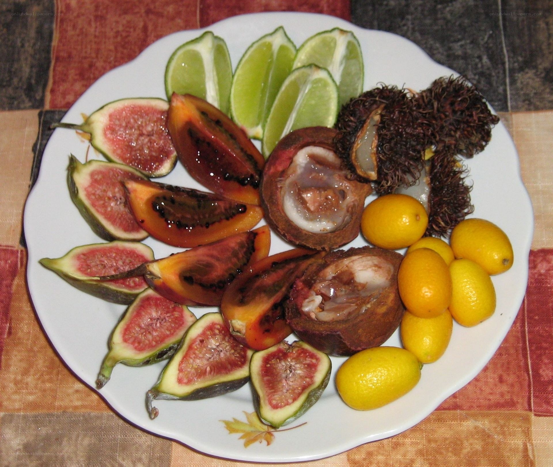 assorted tropical fruits on a plate