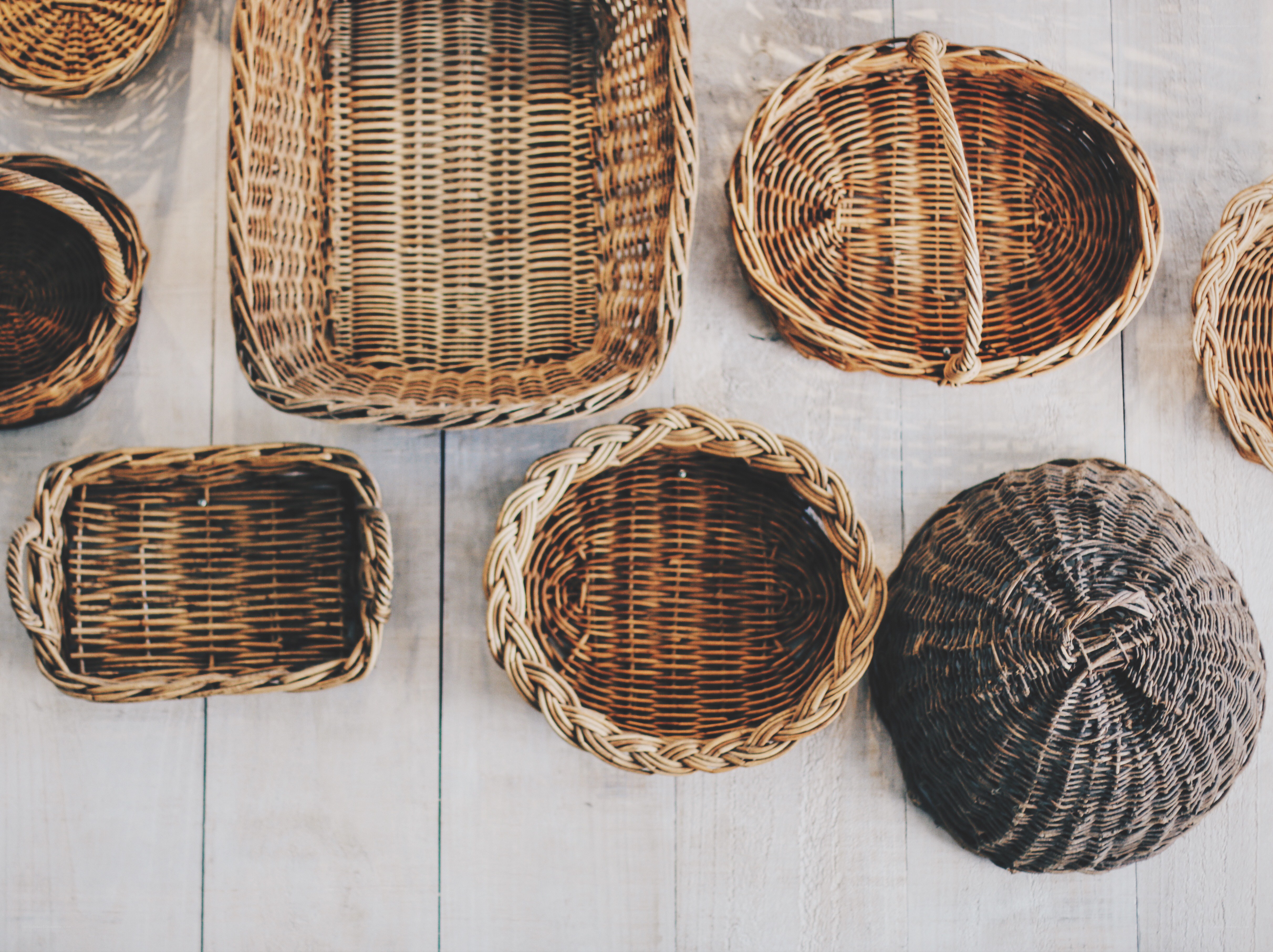 Assorted wicker baskets on wood