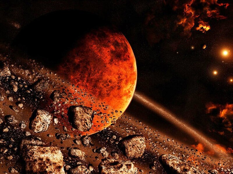 Asteroid field near a red planet