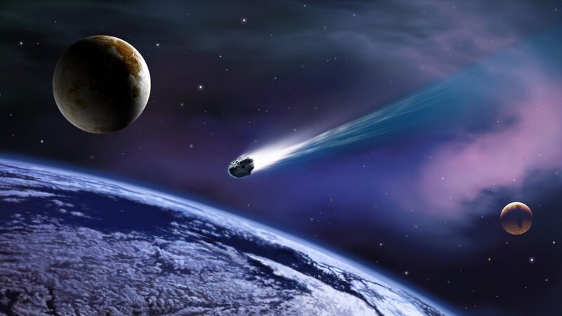 Asteroid flying over a planet