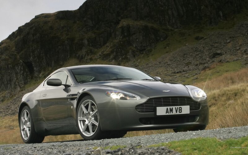 Aston Martin AM V8 on a gravel road