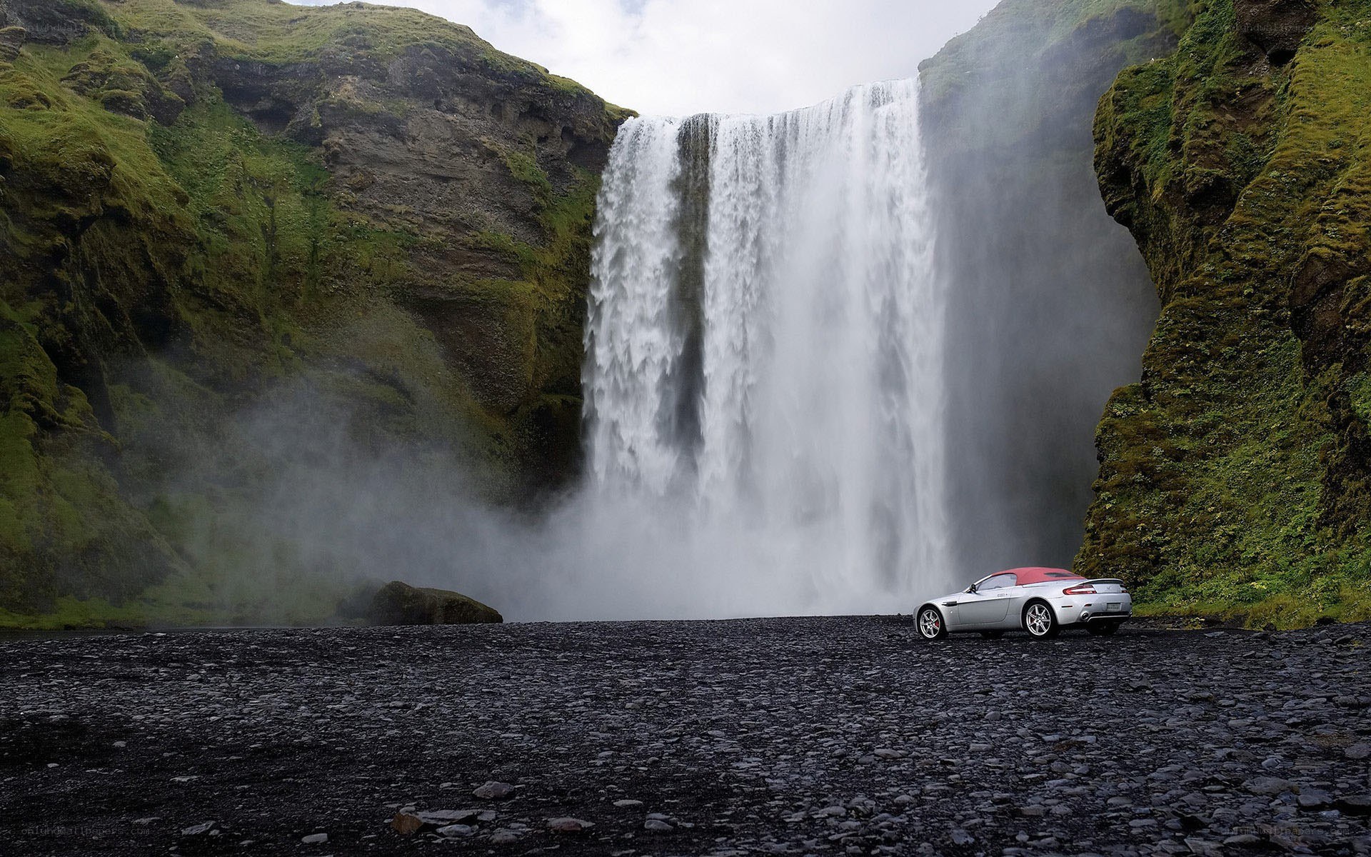 Aston Martin at a waterfall