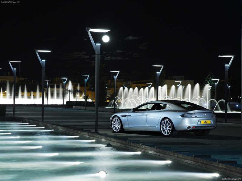 Aston Martin at night by fountains
