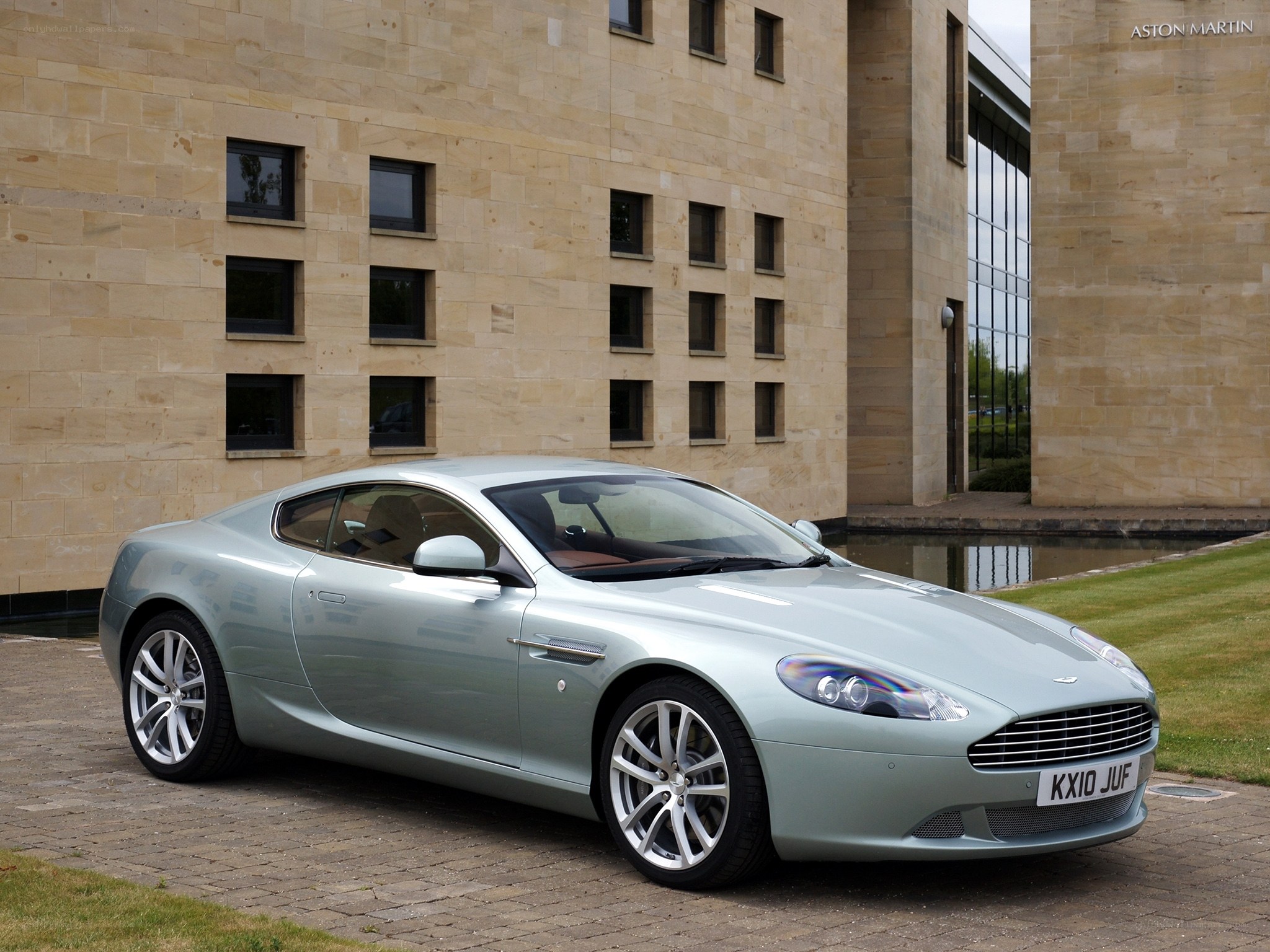 Aston Martin DB9 in front of building