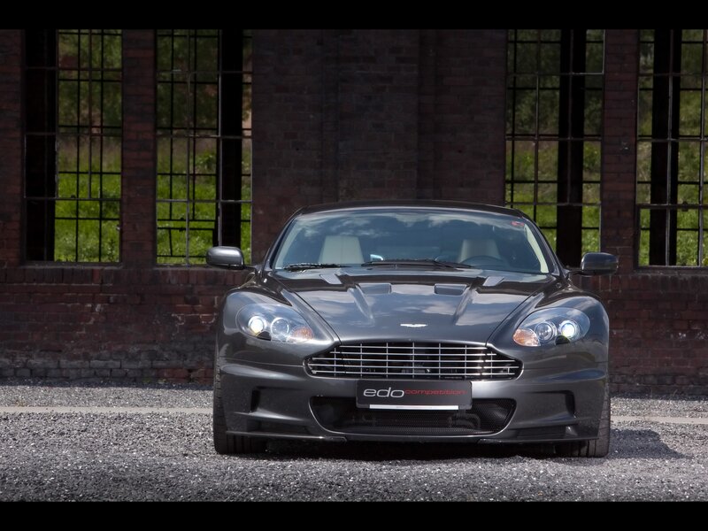 Aston Martin DBS in front of brick building